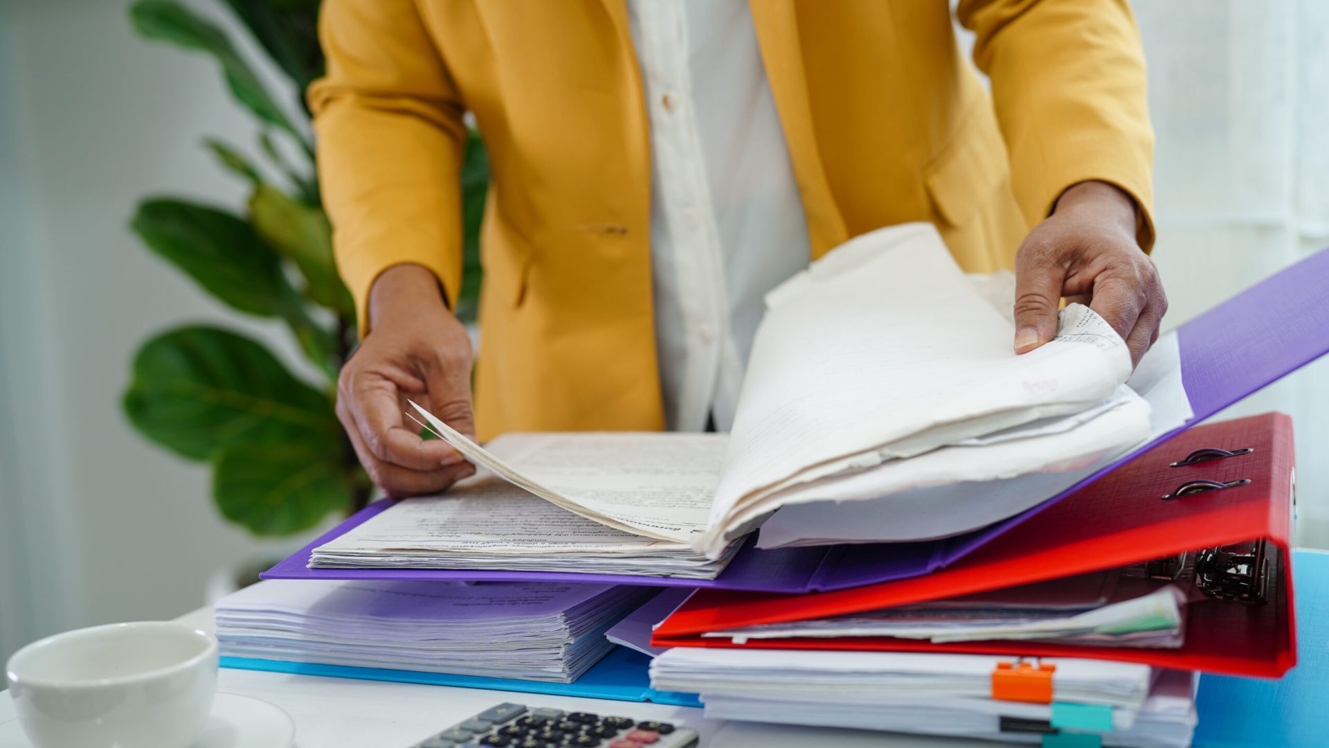 Businessman working and prepare paperwork report data to analysis information in file binder at office.